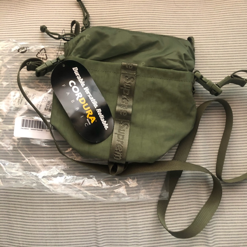 Supreme neck pouch. New. Sticker included.